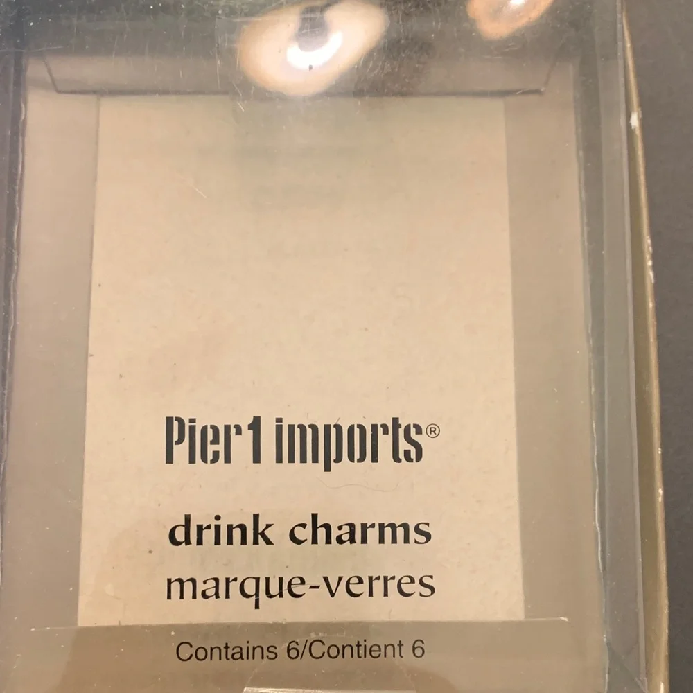 Pier 1 drink charms in the shape of flip flops. Only 3 charms available.